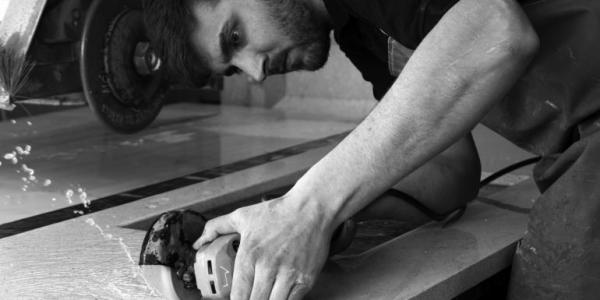 A Henderstone team member cutting a quartz worktop to size